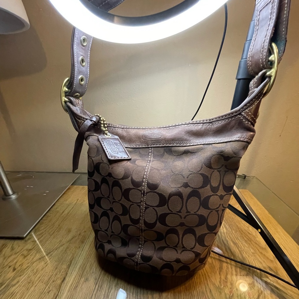 Brown monogram Coach adjustable shoulder bag. Pre-loved Some wear